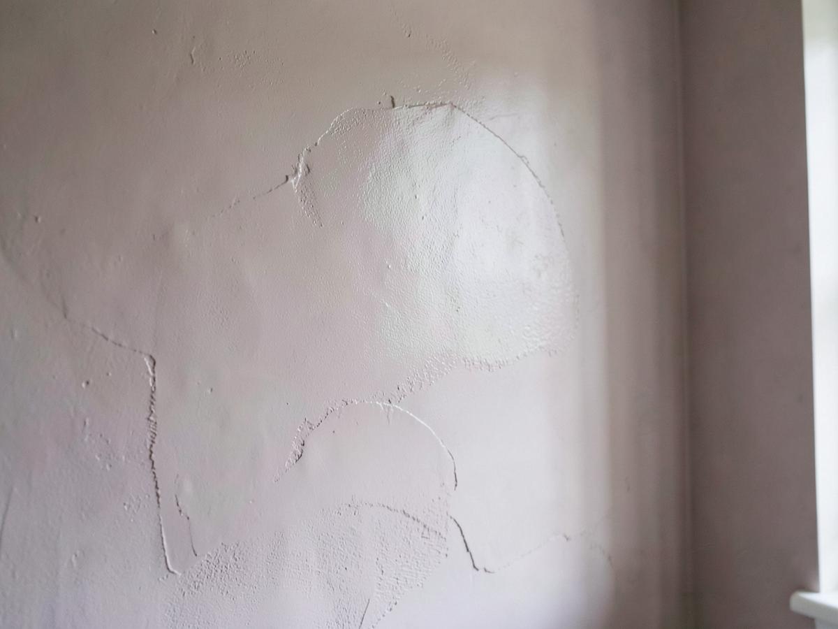 Patched and repaired plaster on an interior wall before finishing